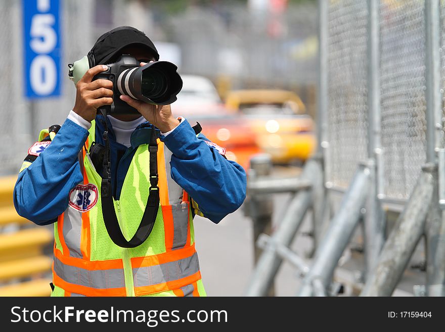 A man takes a photograph, rescue division