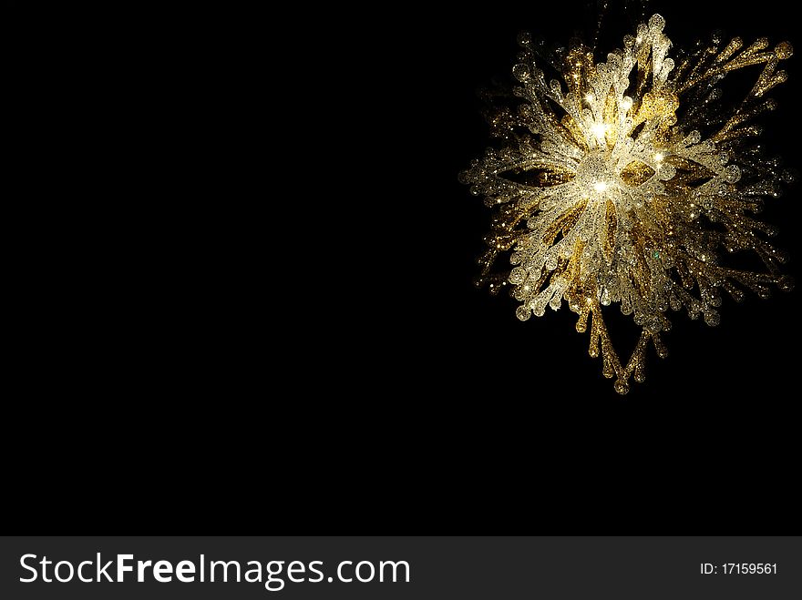 Illuminated snowflake on a black background. Illuminated snowflake on a black background.