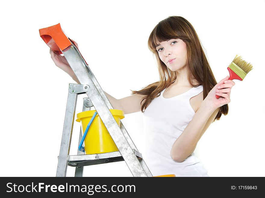 Attractive girl with paintbrush over white