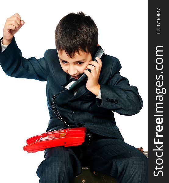 Young boy talking on the phone isolated on white background