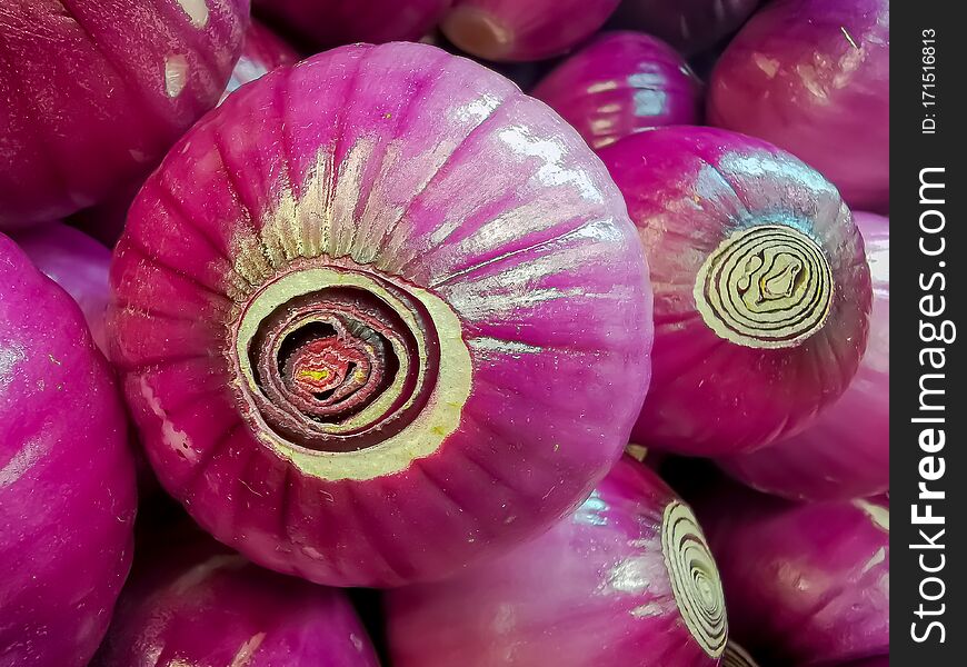 Organic red onions sold at local farmers market. Organic red onions sold at local farmers market.