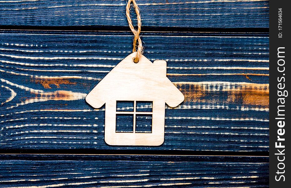 House Symbol On A Wooden Background