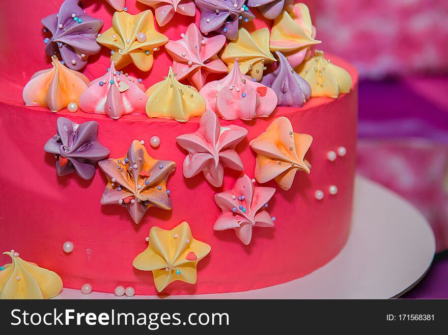 Pink cheerful cake with cream stars