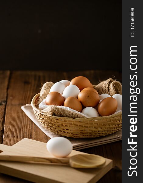 Chicken eggs in basket on table.
Fresh chicken eggs.