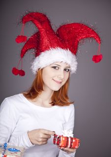 Funny Red-haired Girl In Christmas Cap Stock Image
