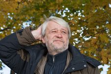 Portrait Of Middle-aged Man In Autumn Day. Royalty Free Stock Image