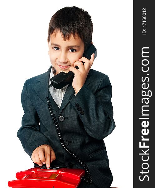 Young boy talking on the phone isolated on white background