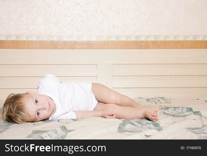 Cute child playing on bed. Cute child playing on bed