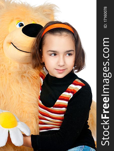 Beautiful girl with a bright orange bear. Beautiful girl with a bright orange bear
