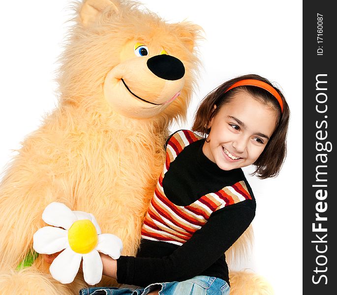 Beautiful girl with a bright orange bear. Beautiful girl with a bright orange bear