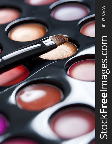 Professional lipstick palette and brush closeup