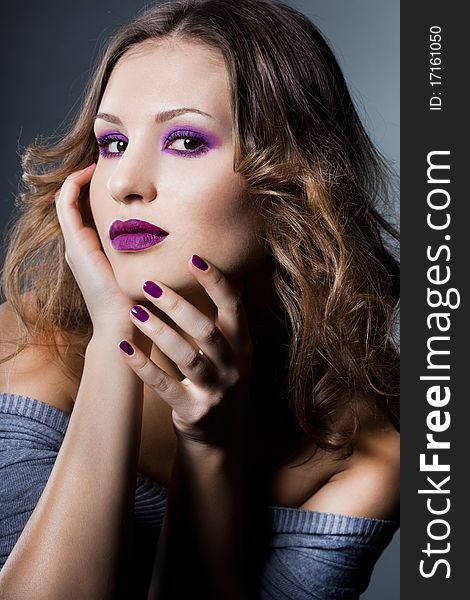 Elegant fashionable woman with violet visage