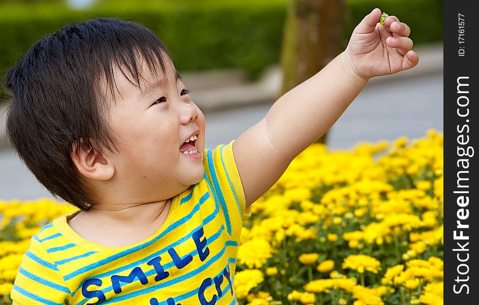 A happy baby is playing