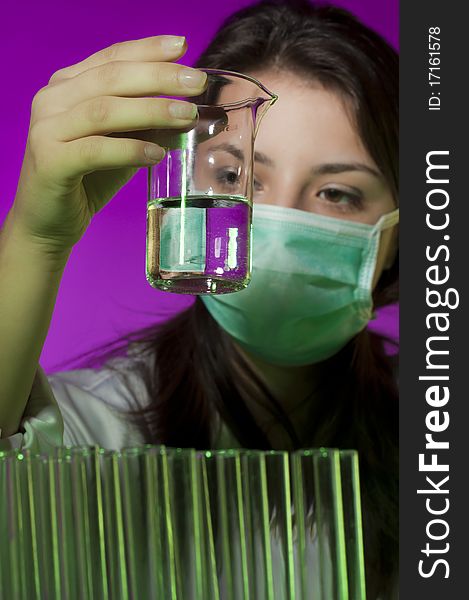 Young scientist in laboratory examining sample