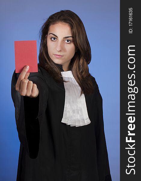 Young lawyer (judge) holding a red card. Young lawyer (judge) holding a red card