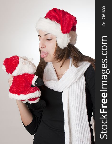 Young girl holding santa claus gift. Young girl holding santa claus gift