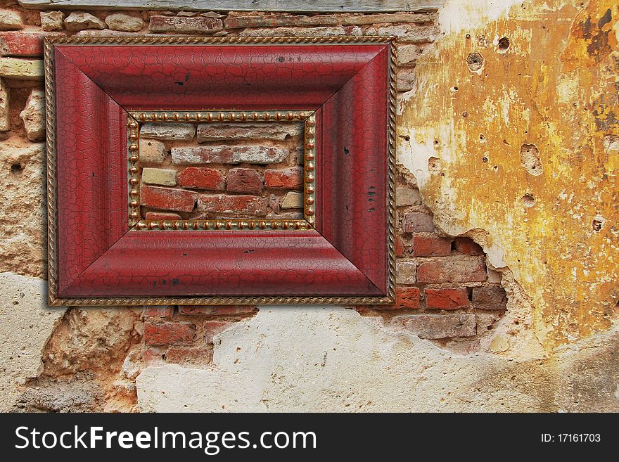 Empty picture frame on an old weathered brick wall with stucco.