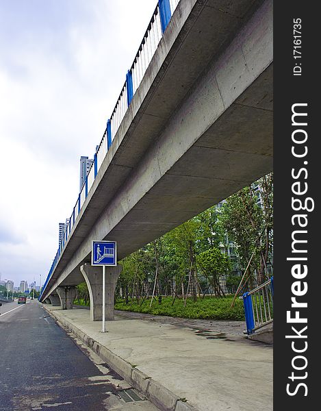 Urban roads under overpass pass the downtown