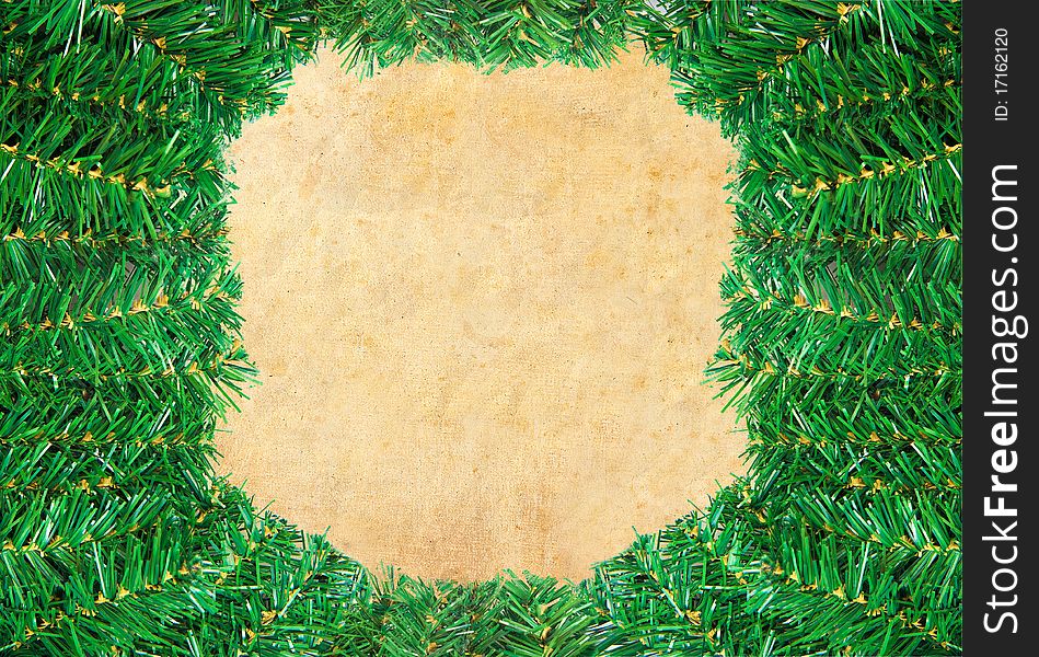 Christmas green framework with Pine needles isolated on paper textures background