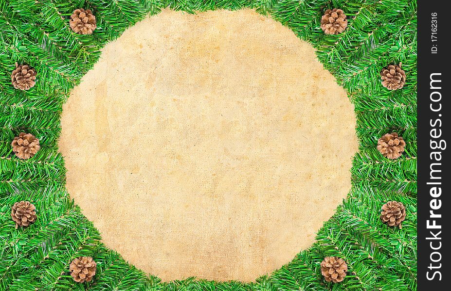 Christmas green framework with Pine needles and cones  isolated on paper textures background. Christmas green framework with Pine needles and cones  isolated on paper textures background