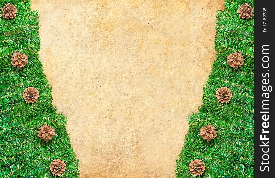 Christmas green framework with Pine needles and cones isolated on paper textures background. Christmas green framework with Pine needles and cones isolated on paper textures background