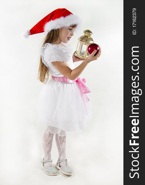 Cute cheerful little girl in a cap of Santy. Cute cheerful little girl in a cap of Santy