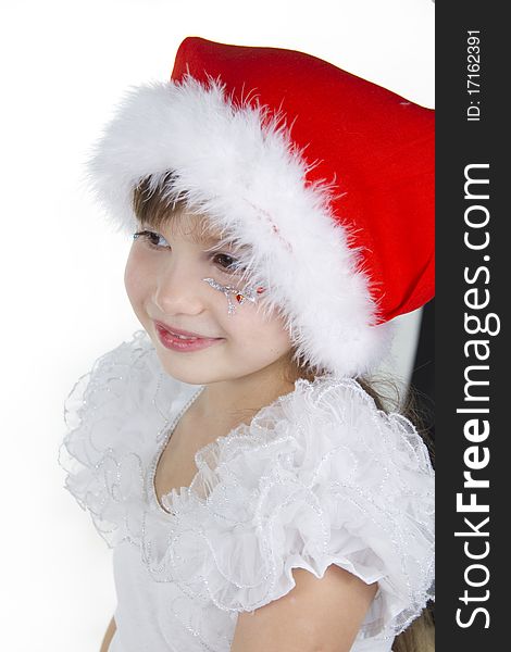 Cute cheerful little girl in a cap of Santy. Cute cheerful little girl in a cap of Santy