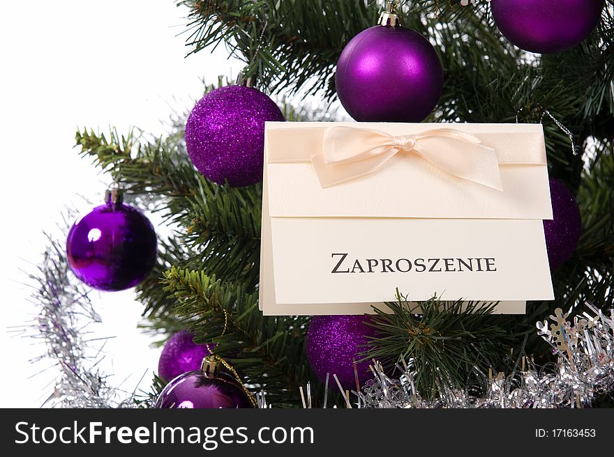 Invitation card on christmas tree