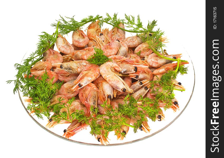 Boiled shrimps with the roe and the dill on the glass plate