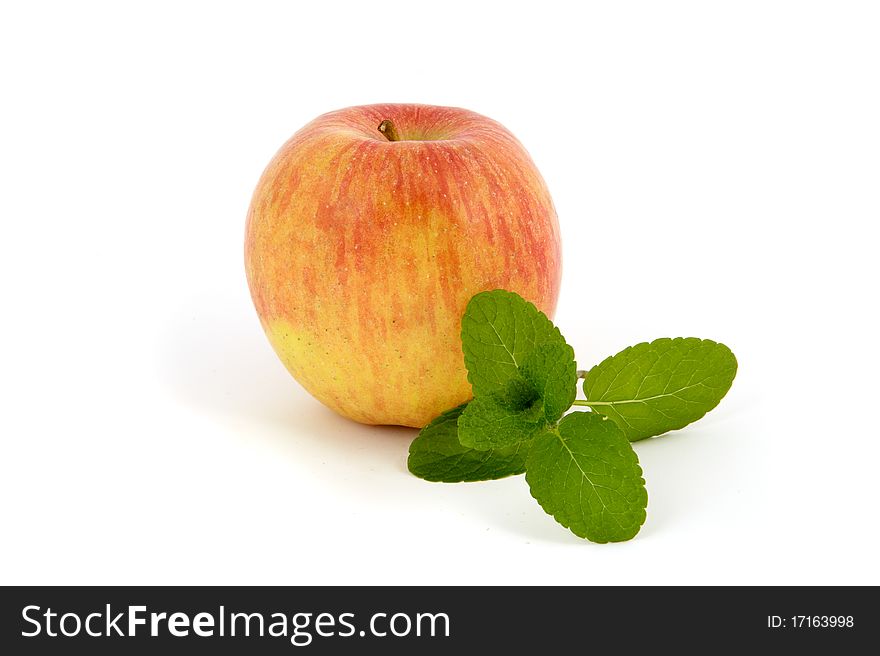 Fresh apple with mint leaf isolated on white background