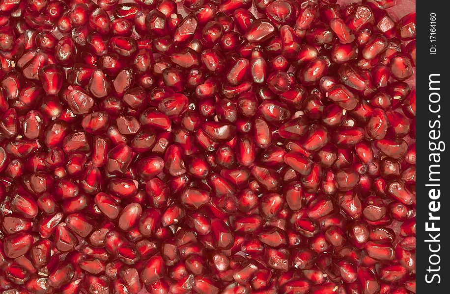 Ripe red grains of a garnet, uniformly scattered. Ripe red grains of a garnet, uniformly scattered