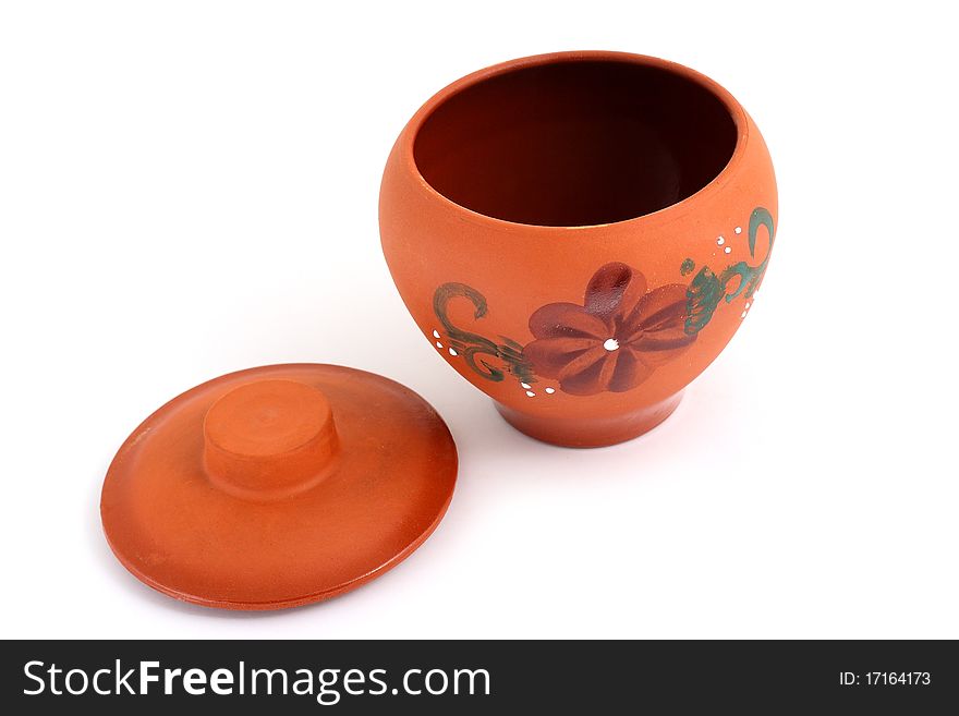 Orange clay pot with a pattern for meal preparation. Orange clay pot with a pattern for meal preparation