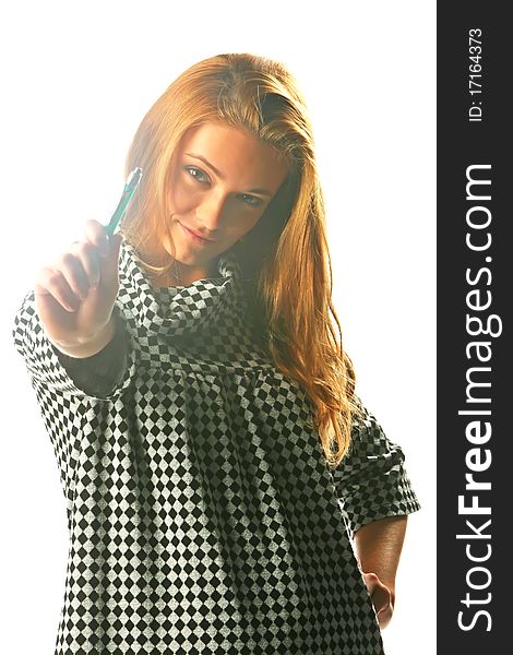 Blonde girl in a checkered dress with pen