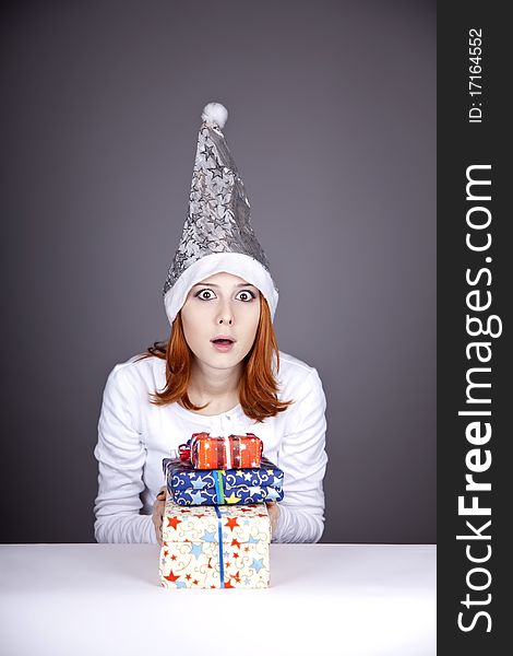 Surprised Red-haired Girl In Christmas Cap