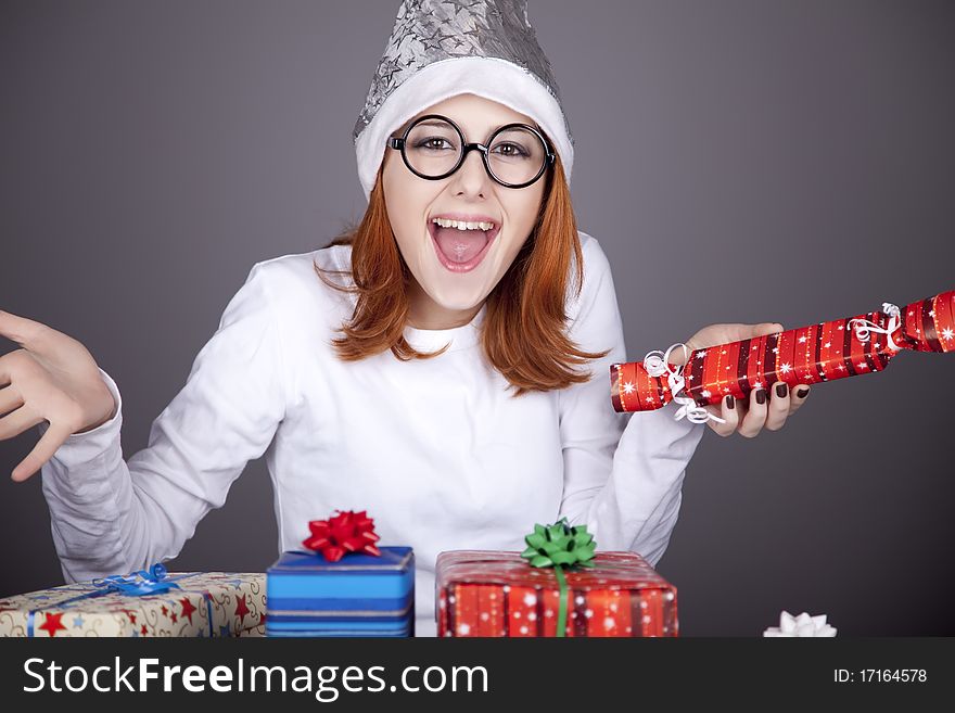 Surprised Red-haired Girl In Christmas Cap