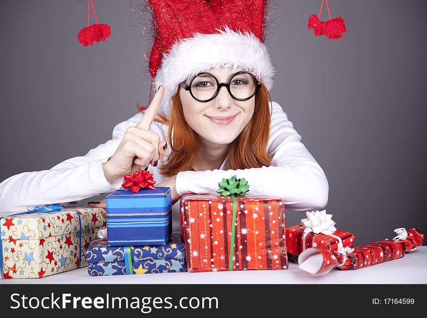 Surprised Red-haired Girl In Christmas Cap