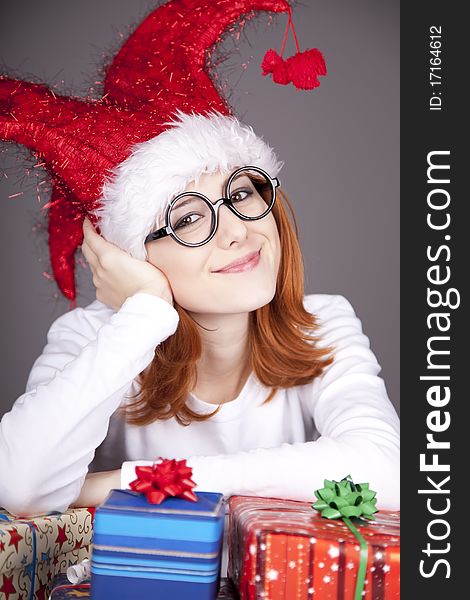 Surprised Red-haired Girl In Christmas Cap