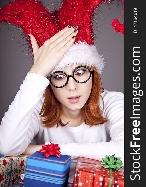 Surprised Red-haired Girl In Christmas Cap