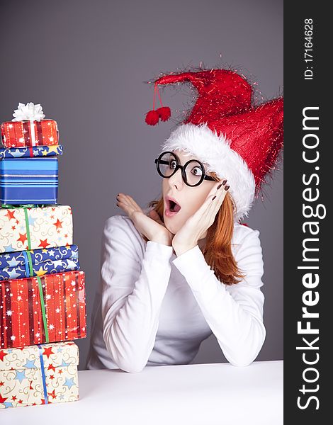 Surprised Red-haired Girl In Christmas Cap