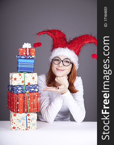 Surprised Red-haired Girl In Christmas Cap