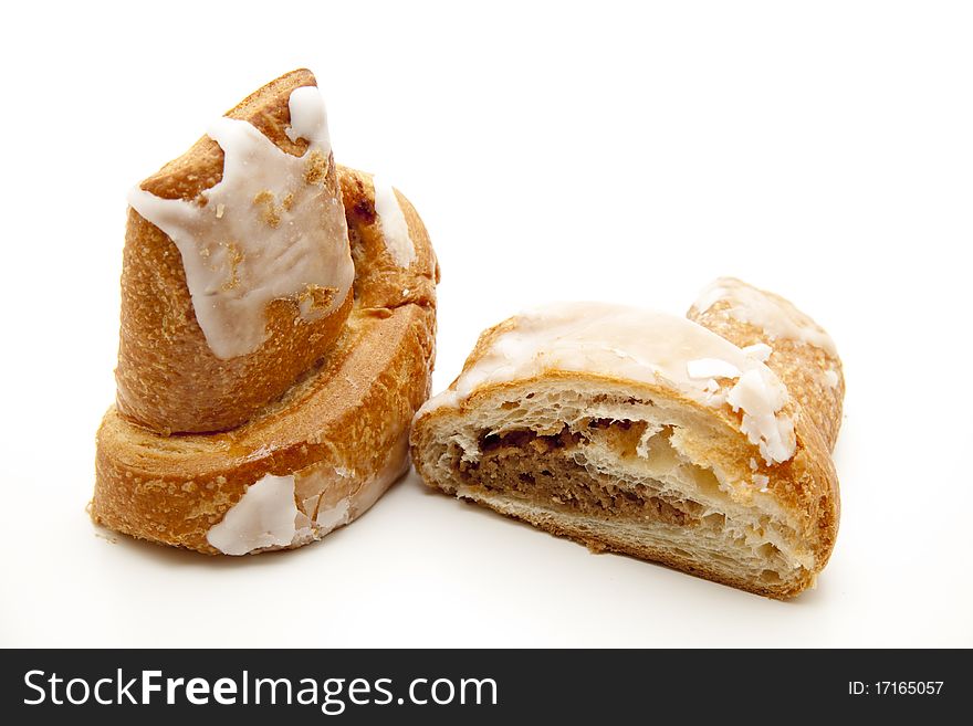 Pastry with nut filling and onto white background. Pastry with nut filling and onto white background