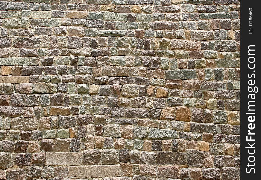 Detail of an old  stone wall made out of huge blocks of stone