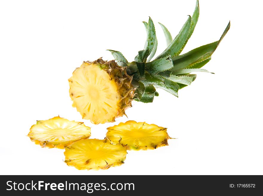 Cut pineapple isolated on white background