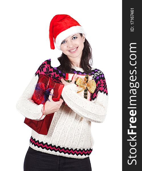 Cheerful and smiling woman in red Santa hat is keeping boxes with gifts. Cheerful and smiling woman in red Santa hat is keeping boxes with gifts