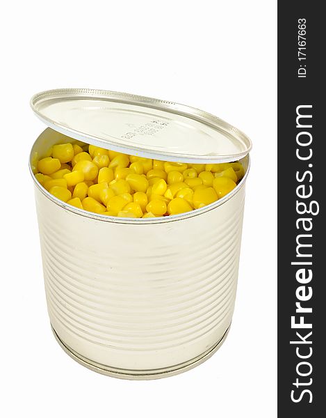 Open Can Of Corn With Lid Over White Background.