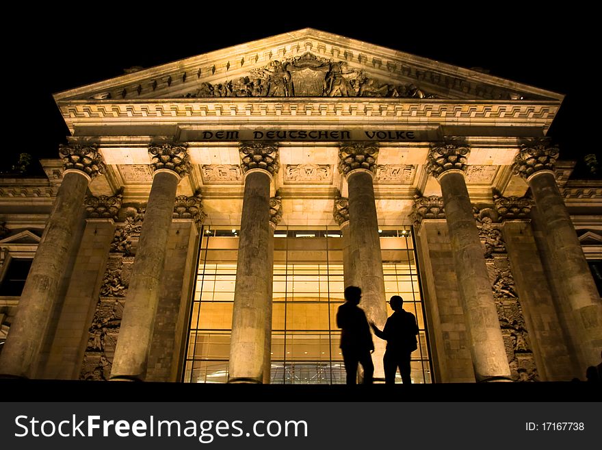 Two guys talking in front of German parliament called Reichstag. Two guys talking in front of German parliament called Reichstag