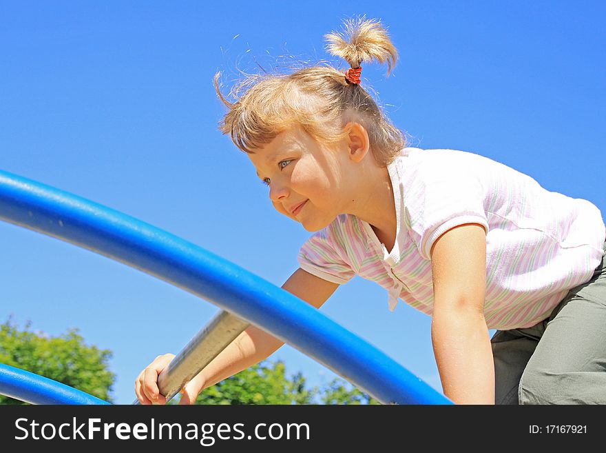 The girl passes through the ladder. The girl passes through the ladder.