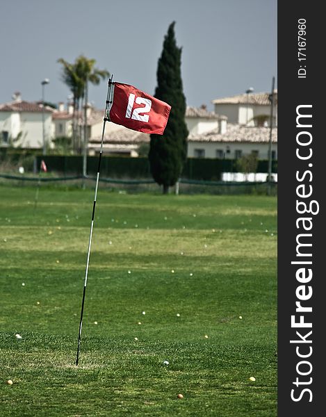 Red flag on driving range of golf course in Spain. Red flag on driving range of golf course in Spain.