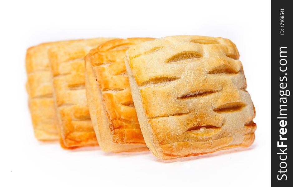 Four pies with cherry jam isolated on white background