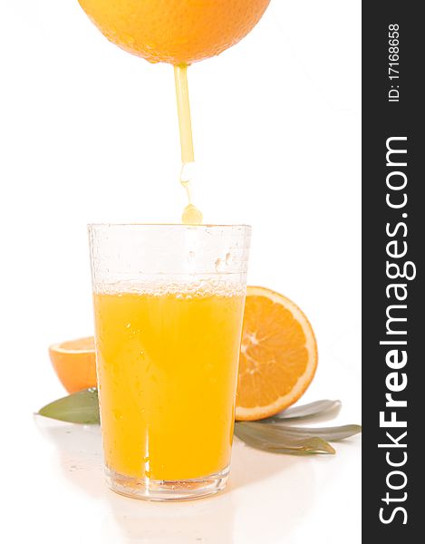 Orange juice and freshly squeezed orange